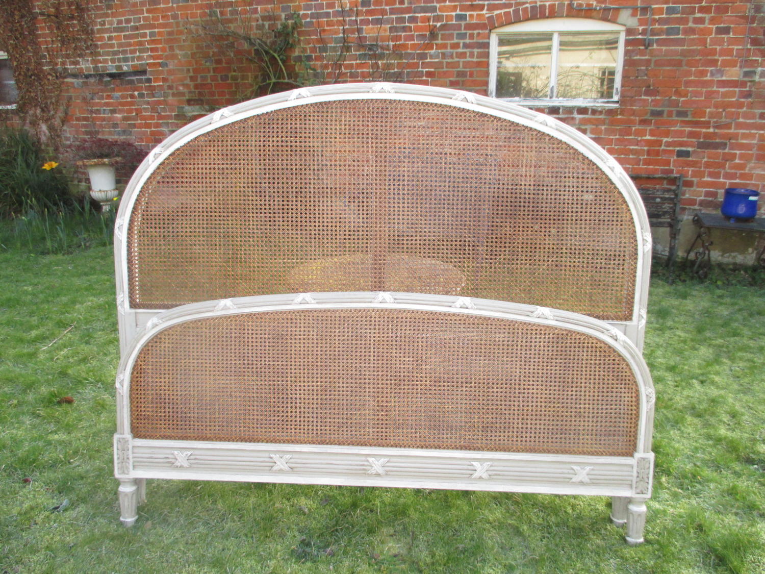 Large caned bed