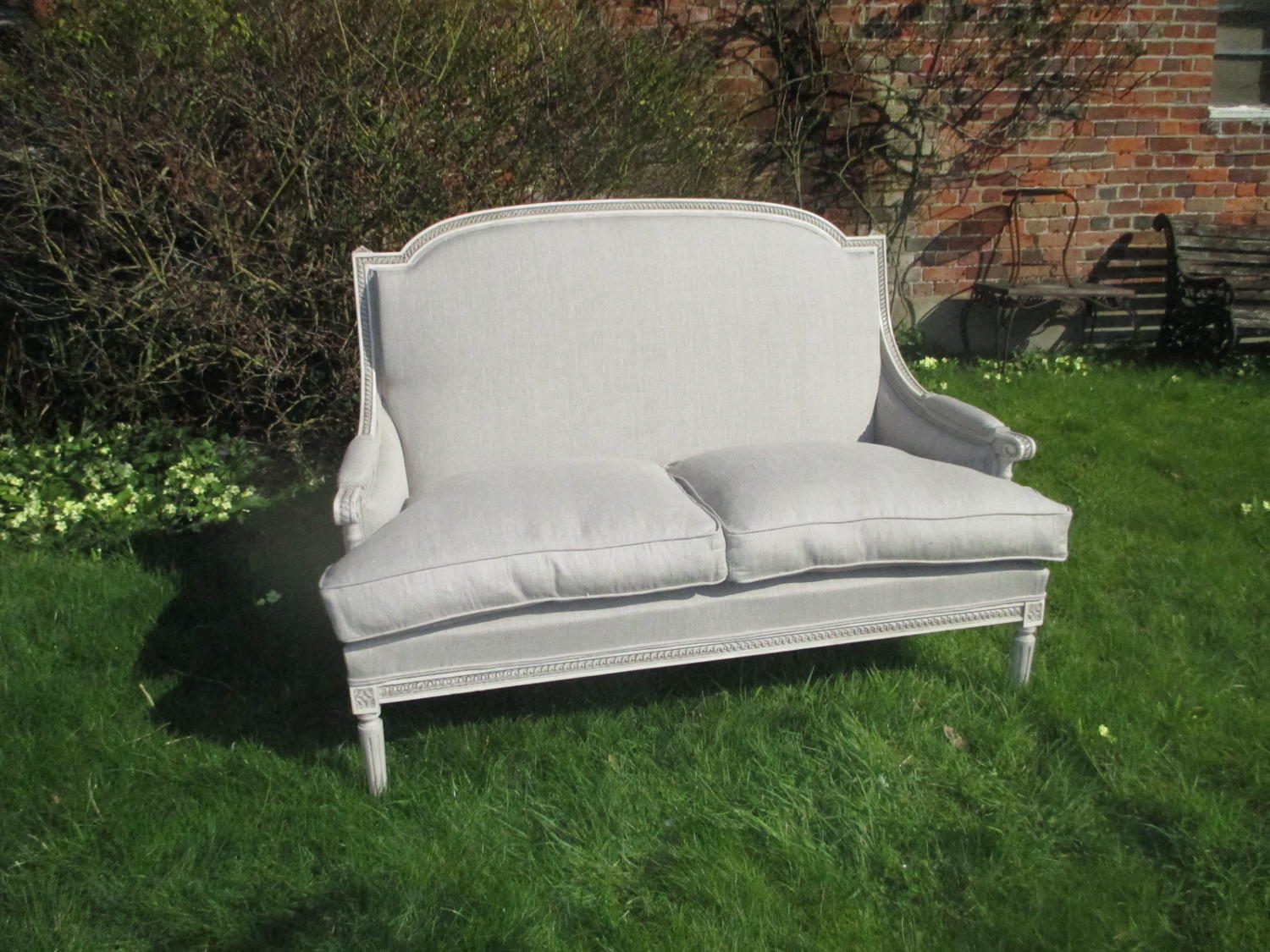 Painted two seater sofa in linen