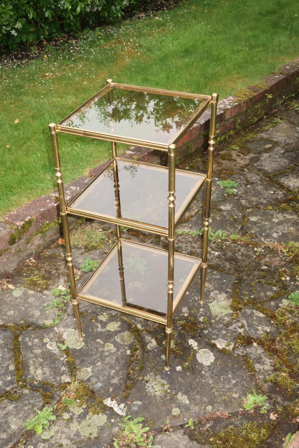 Brass and smoked glass etagere.