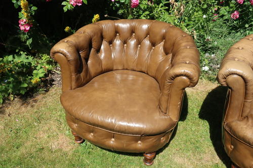 Pair of leather button back chairs
