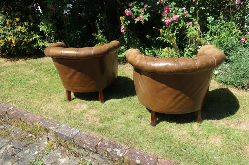 Pair of leather button back chairs