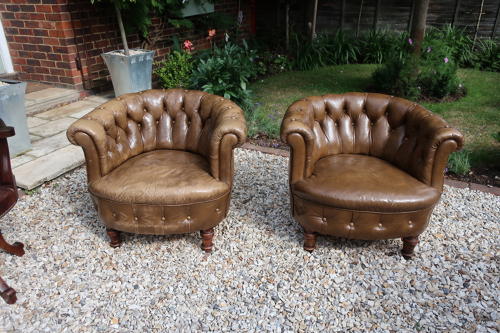 Pair of leather button back chairs