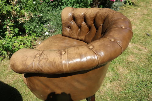 Pair of leather button back chairs