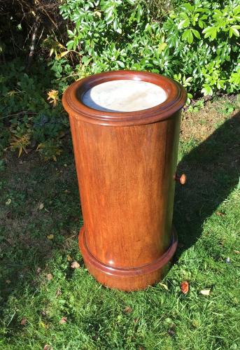 Cylindrical mahogany bedside table
