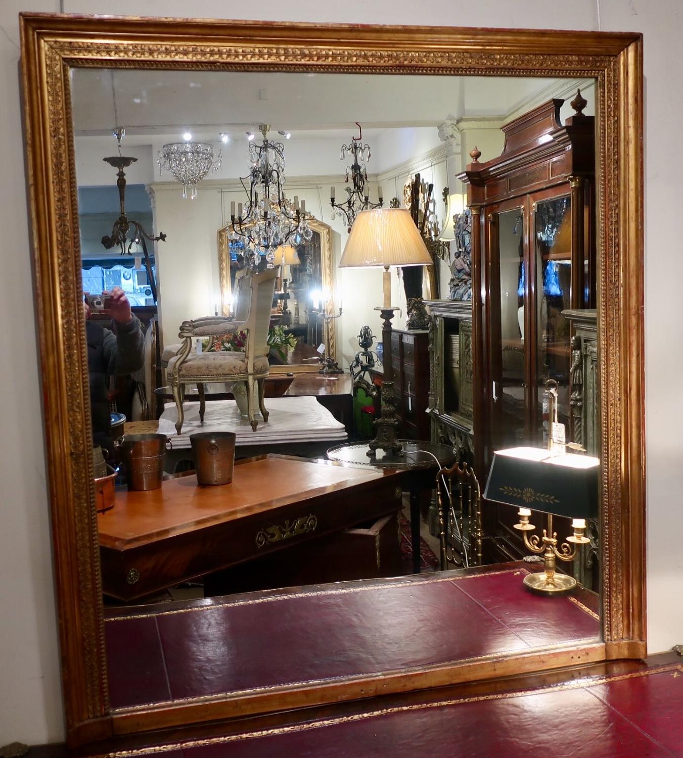Large and wide gilt mirror