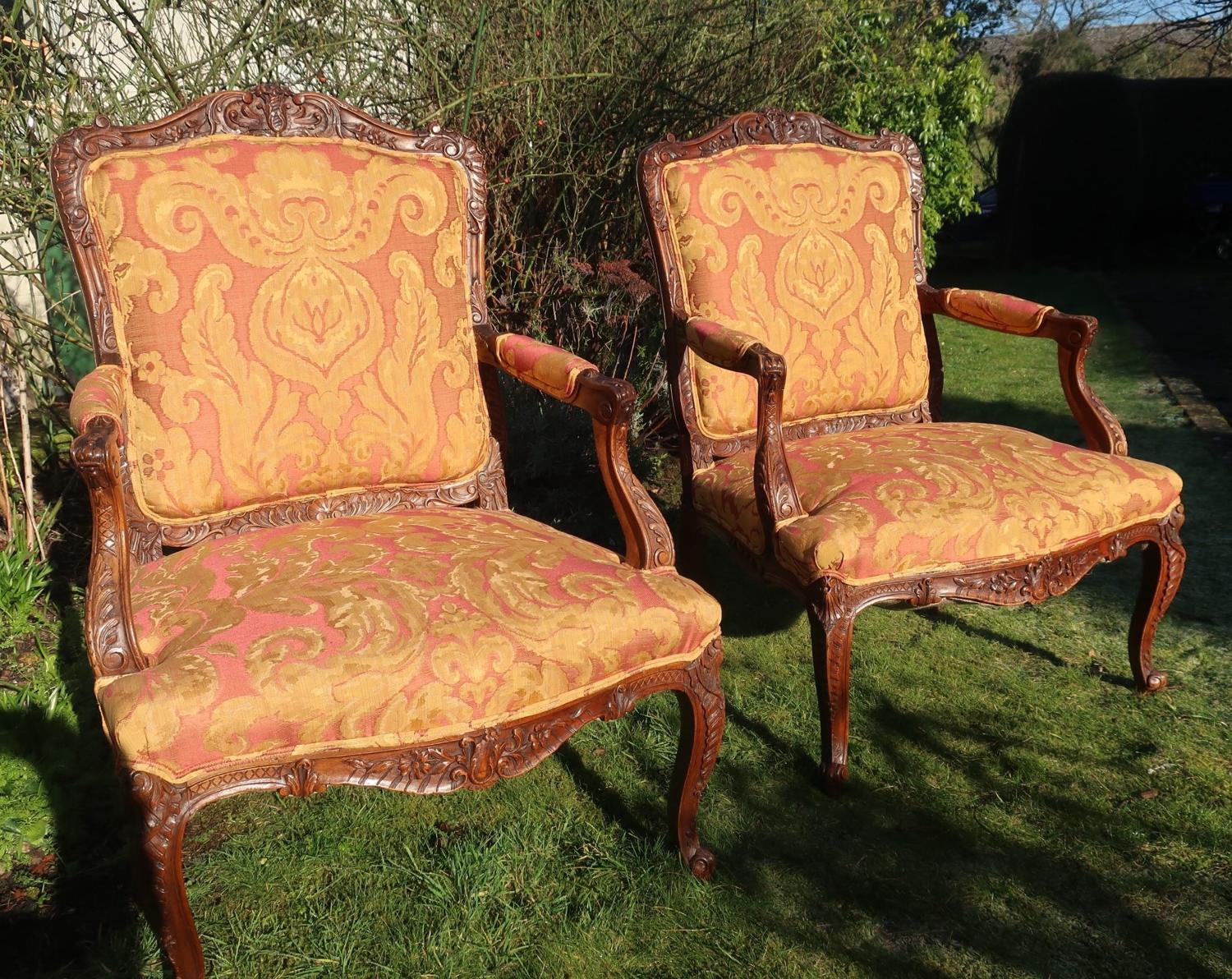 Pair of large scale French Walnut armchairs