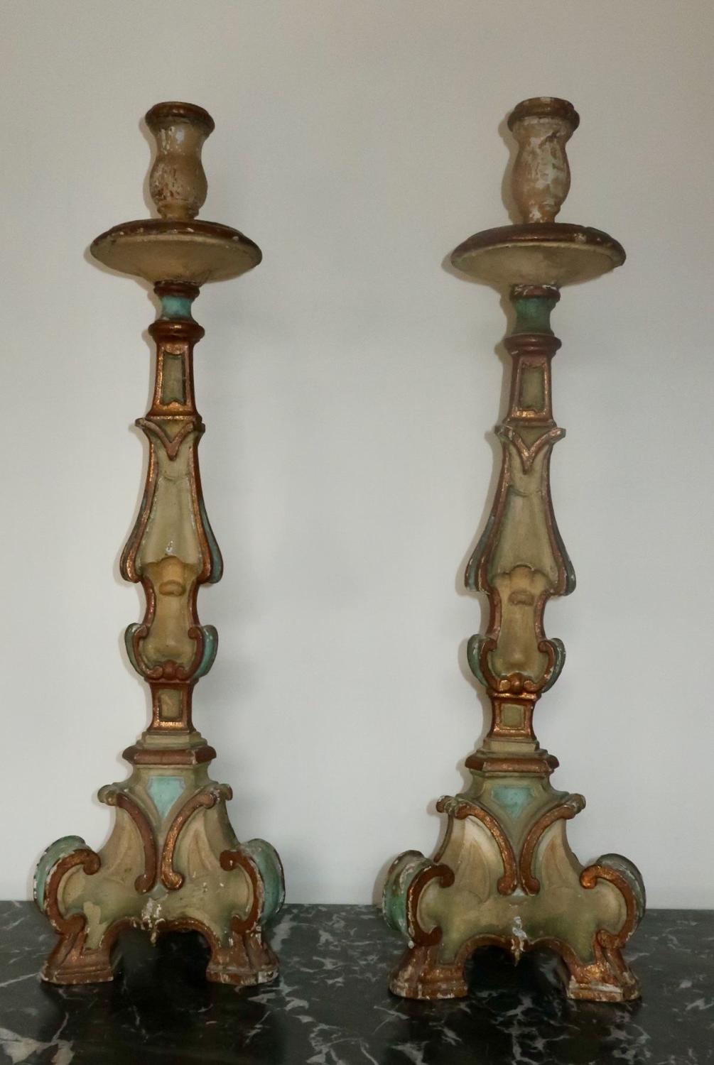 Pair of painted carved wood candlesticks
