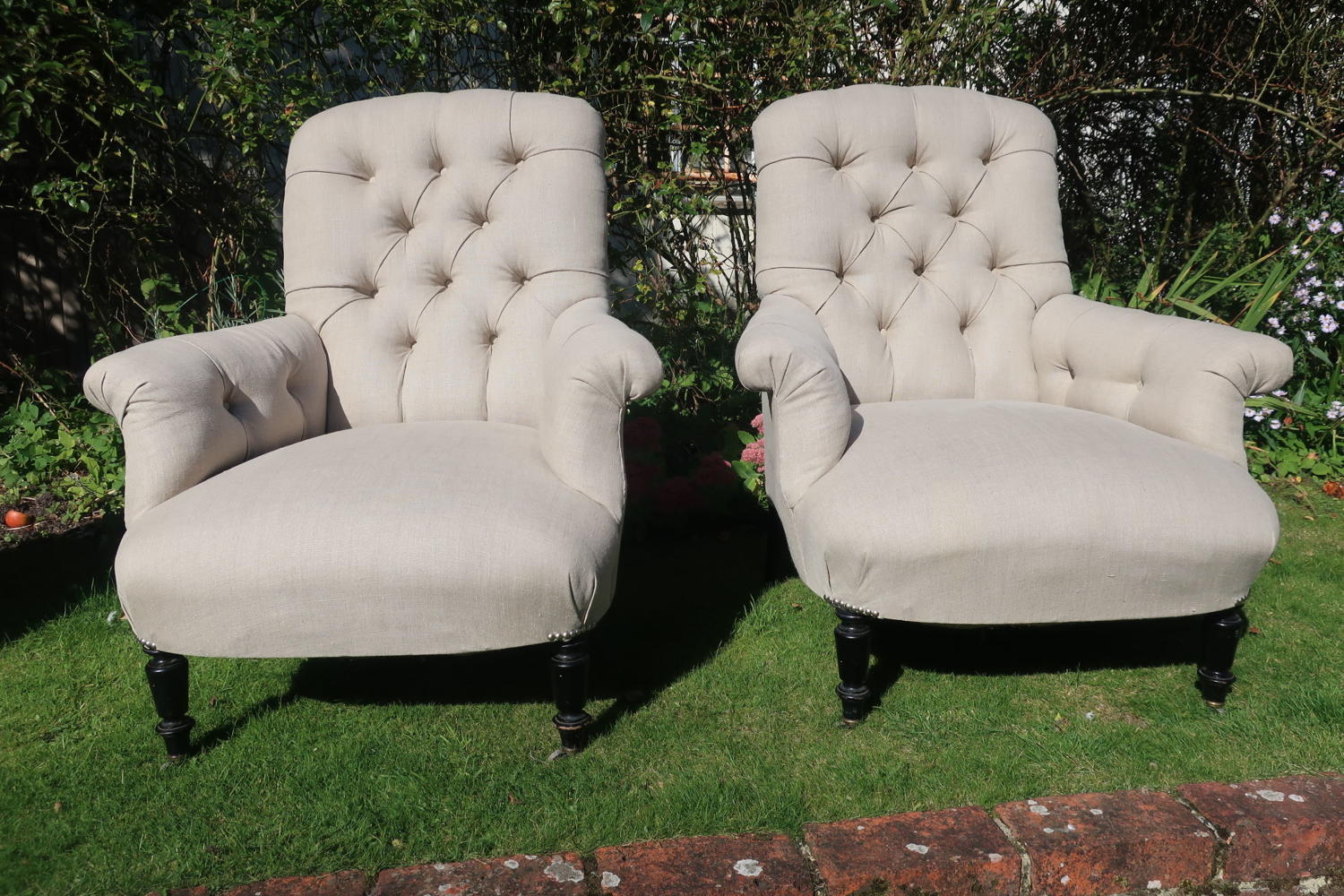 Pair of large button back armchairs