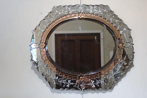 An etched Venitian mirror.