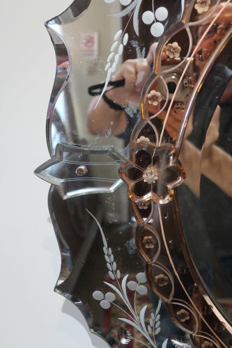 An etched Venitian mirror.