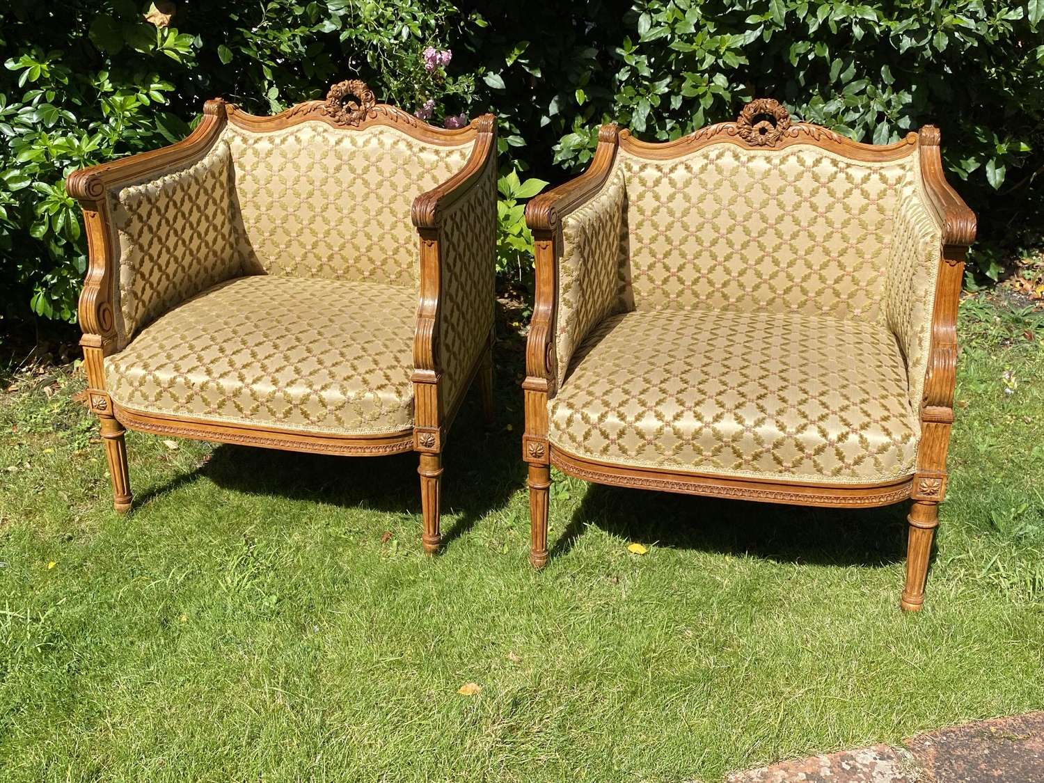 Pair of carved walnut armchairs