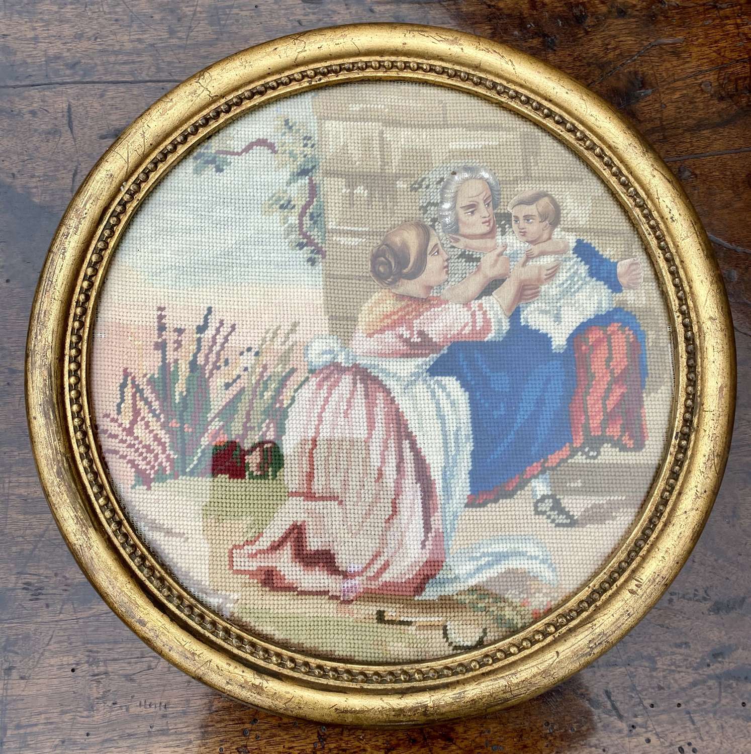 Pair of round 19th Century needlepoint pictures