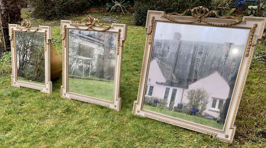 Set of three painted and gilt mirrors