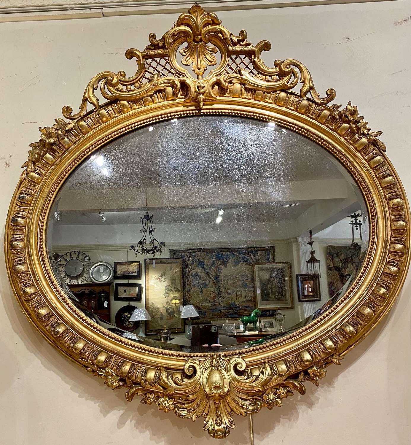 Large gilt oval mirror