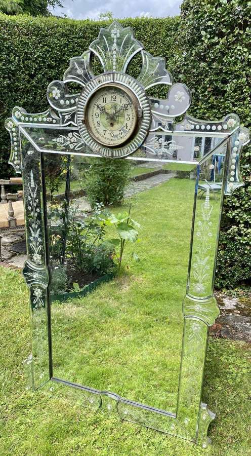 Unusual Venetian mirror with integral clock