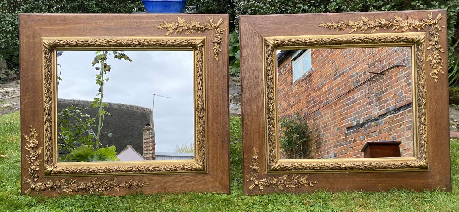 Pair of oak and gilt mirrors