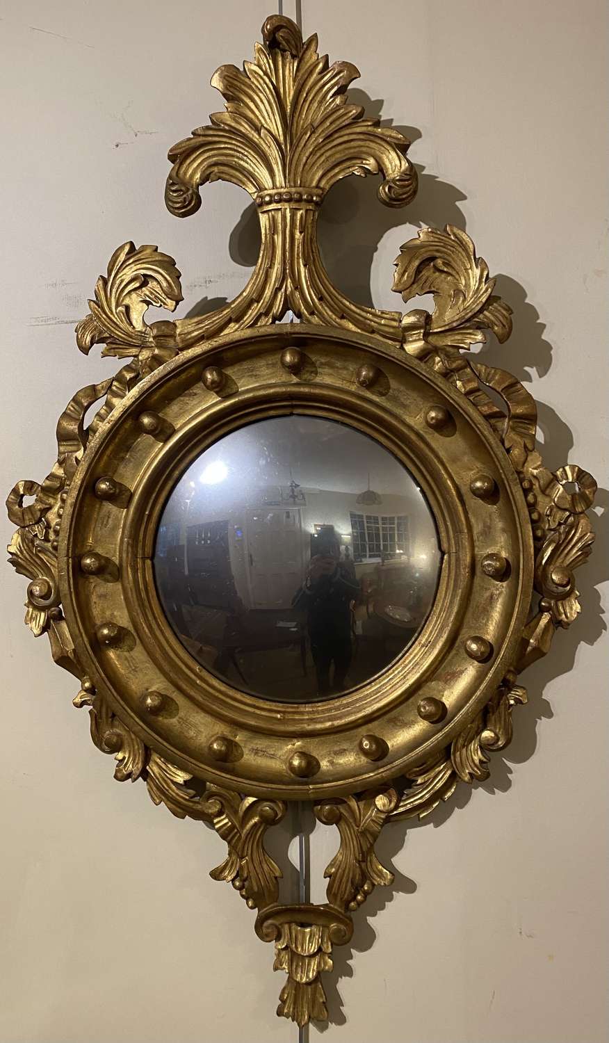 Carved gilt wood convex mirror