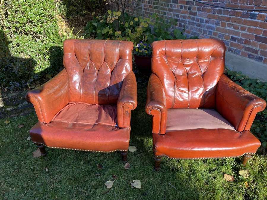 Pair of button back leather armchairs