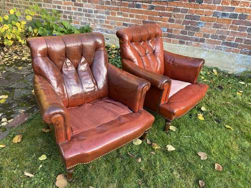 Pair of button back leather armchairs