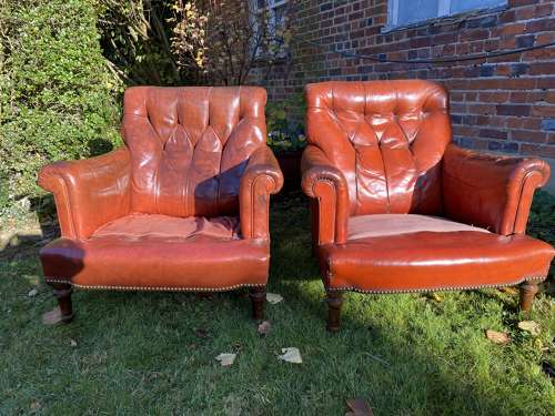 Pair of button back leather armchairs