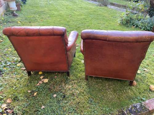 Pair of button back leather armchairs