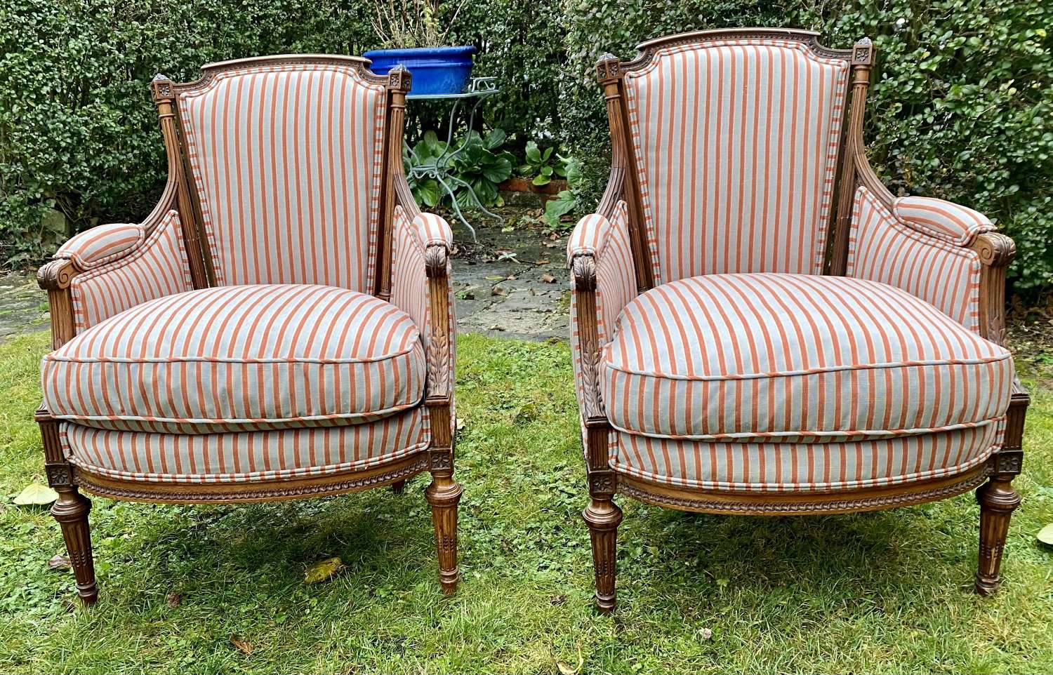 Small pair of walnut upholstered armchairs