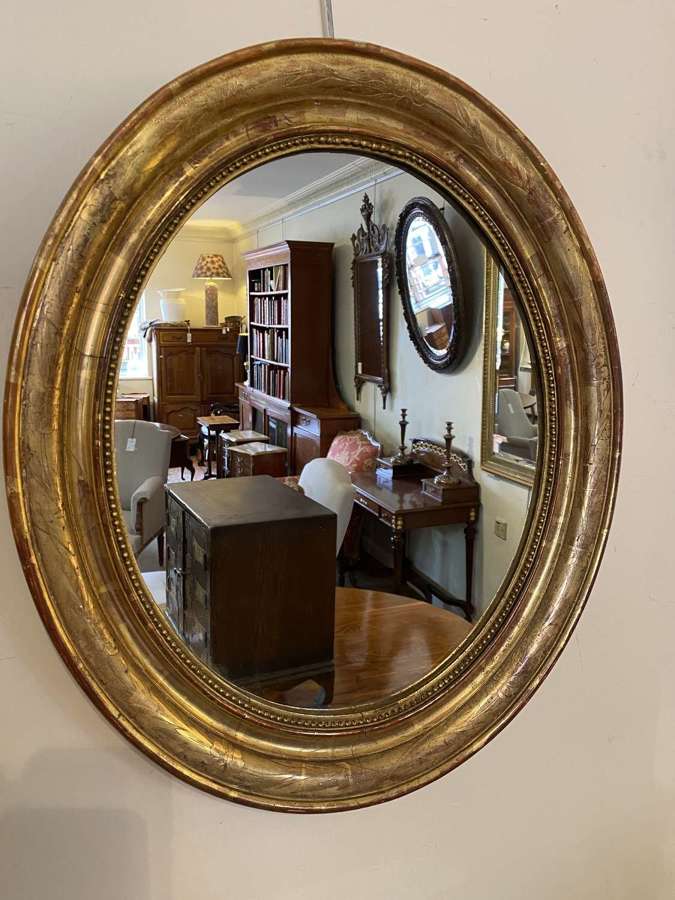 Oval 19th Century gilt mirror