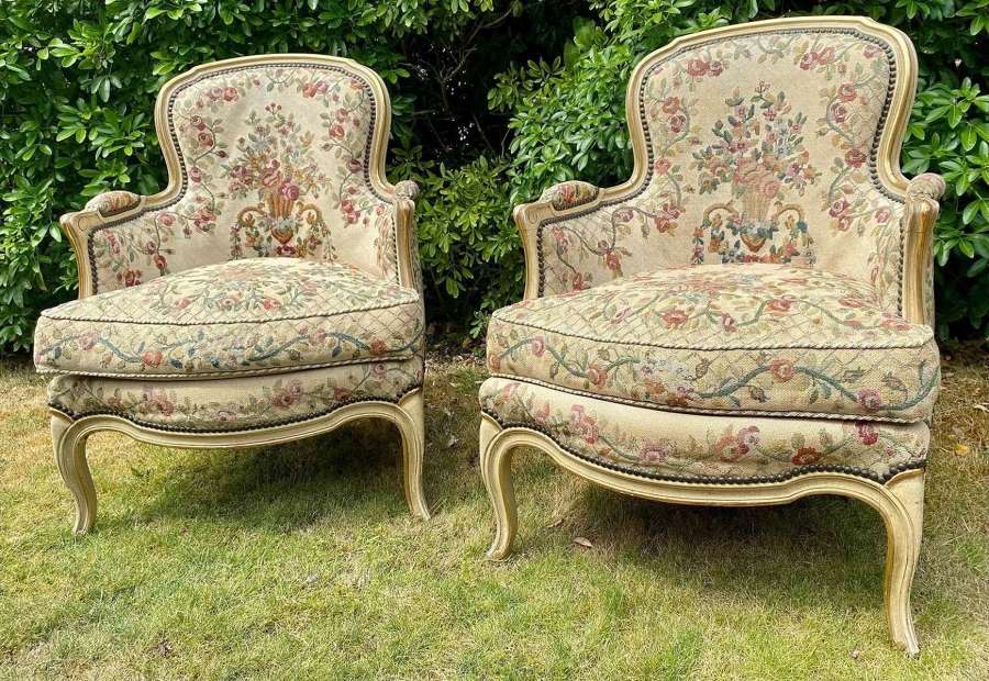Pair of painted and gilt needlepoint Bergere armchairs