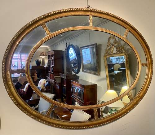 Large oval gilt mirror