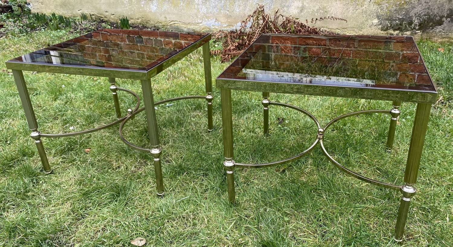 Pair of mid century smoked glass and brass stands