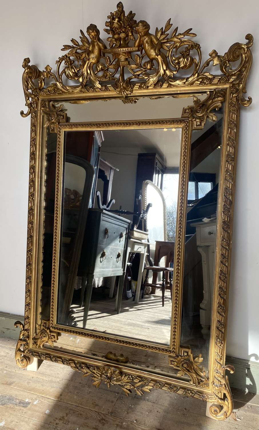 French gilt margin mirror with cupids