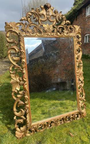 Carved giltwood cushion mirror