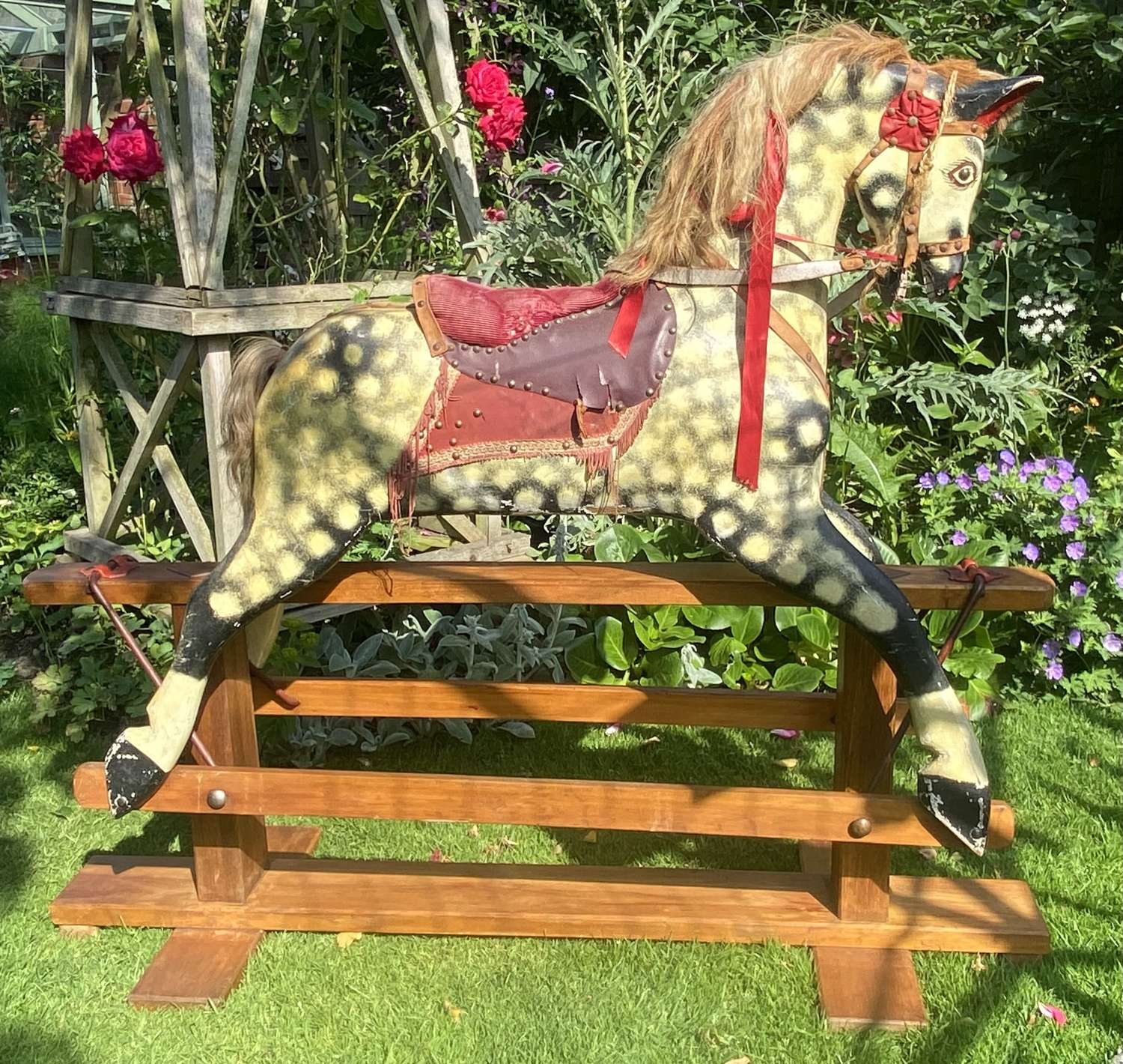 A large Collinsons rocking horse