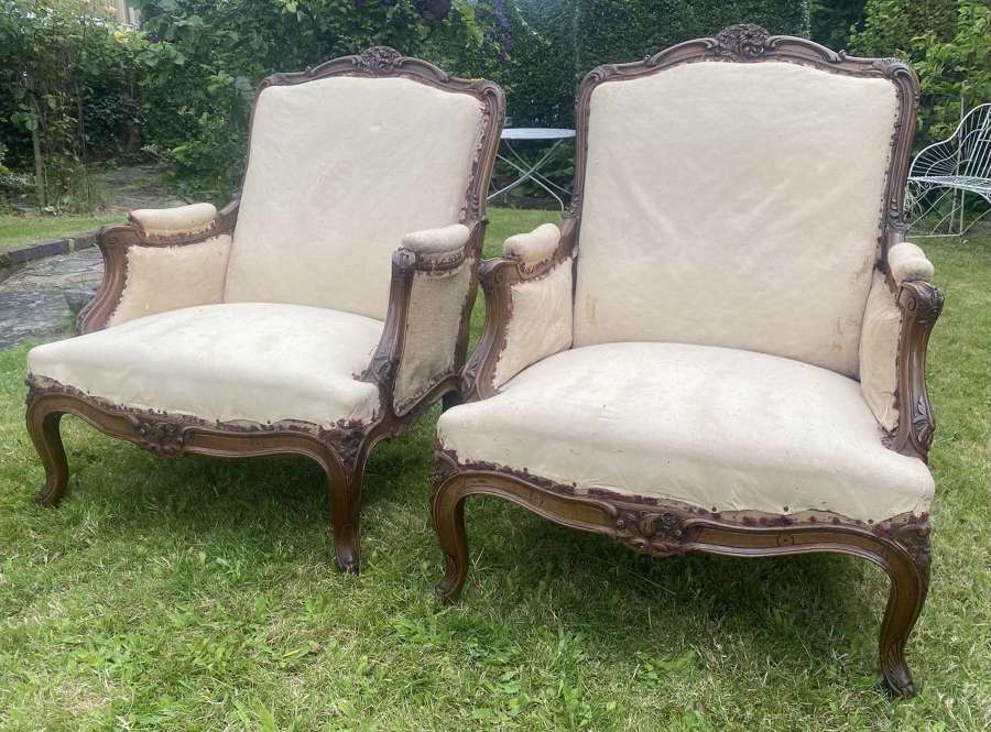 Pair of large carved walnut armchairs