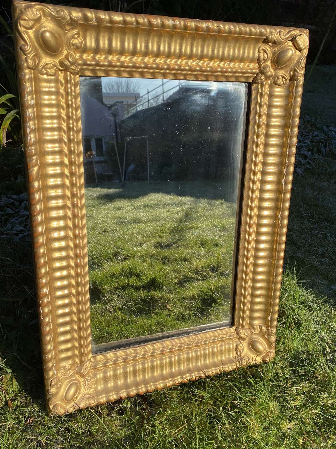 Small ripple gilt mirror