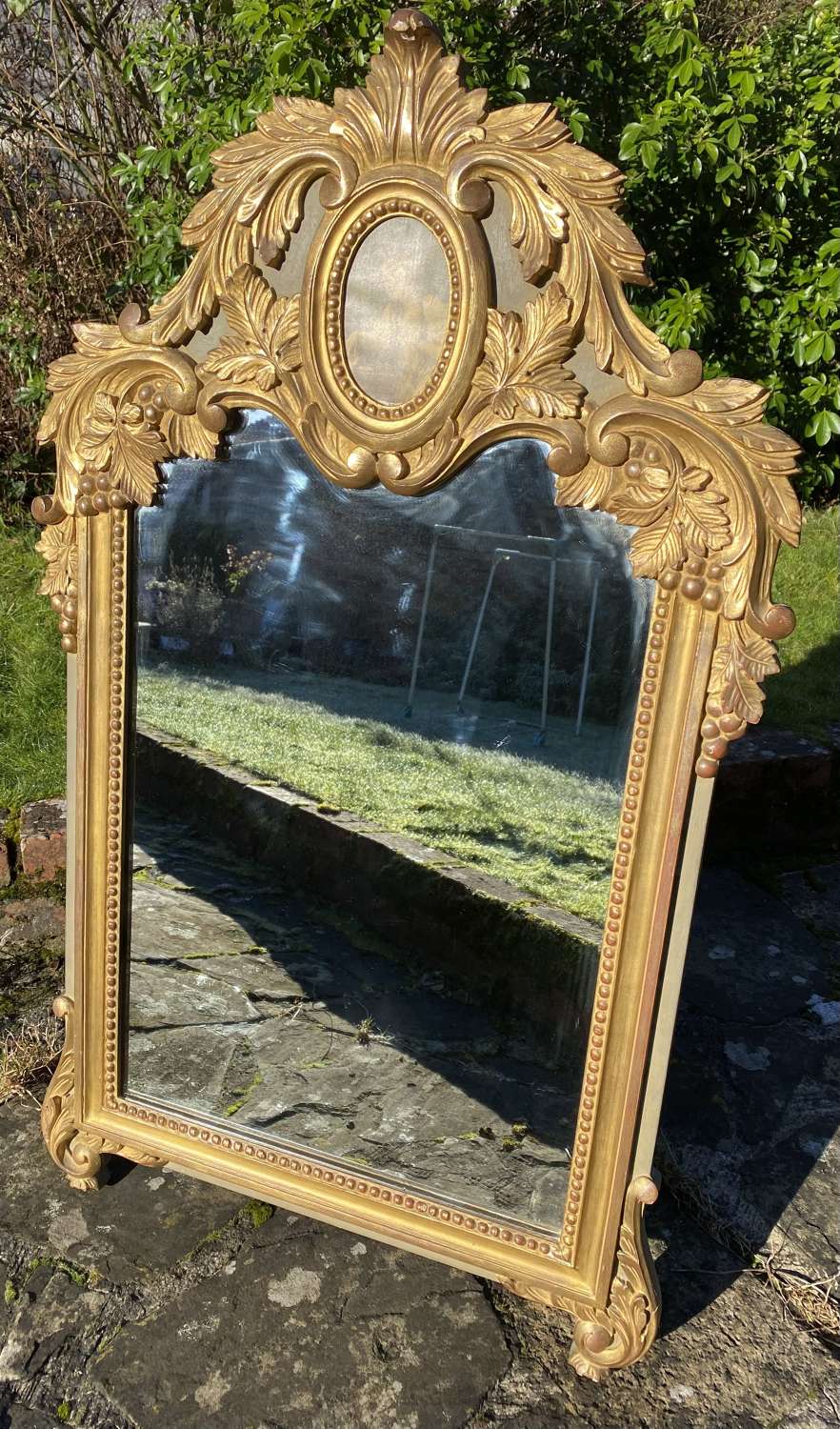 Carved giltwood mirror in the Louis XVI style