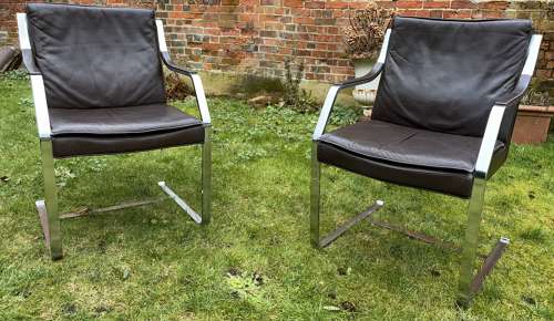 Pair of mid century leather armchairs