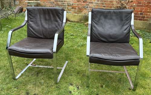 Pair of mid century leather armchairs