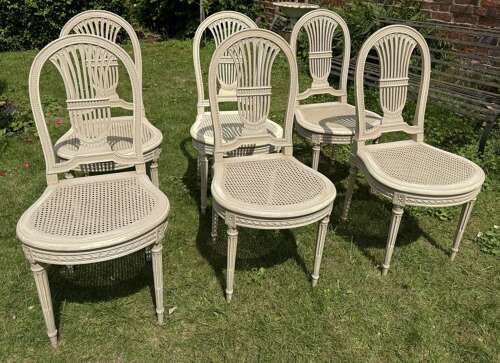 Set of six caned and painted dining chairs