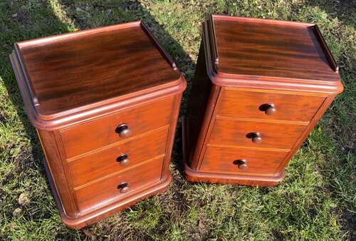Pair of mahogany three drawer bedside tables