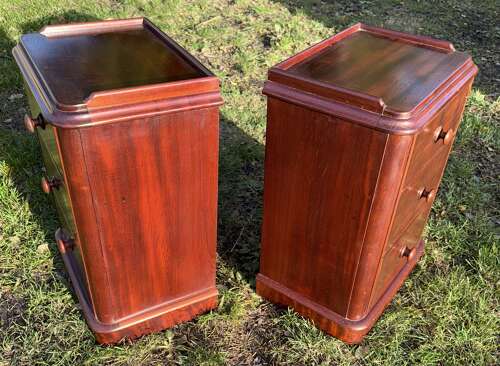 Pair of mahogany three drawer bedside tables