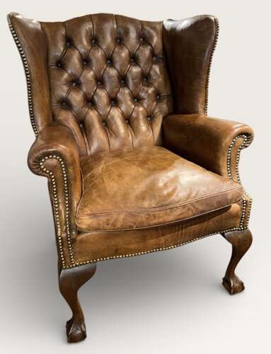 Leather buttoned wingback armchair