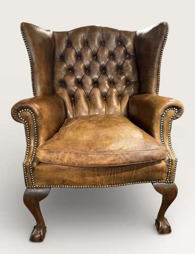 Leather buttoned wingback armchair