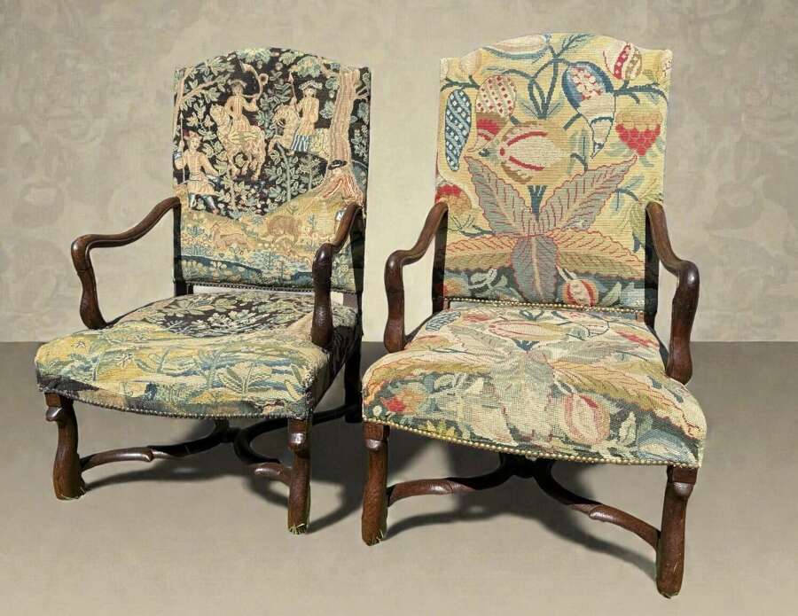 A pair of early 18th Century needlepoint armchairs